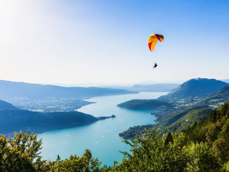 View of tandem paragliders over Annecy Lake from Col du Forclaz