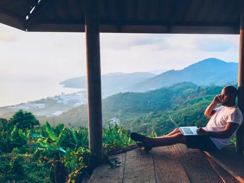 Traveler working remote while enjoying Thailand nature landscape and view