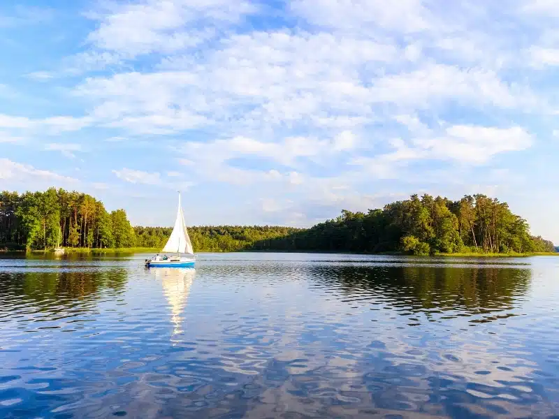 Sailing boat on Lake Nidzkie in Ruciane-Nida, Mazury Lake District, Poland