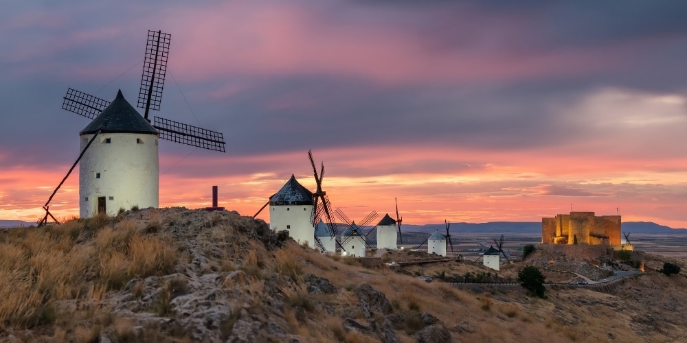 Historic windmills of Consuegra at sunset, Castilla-La Mancha, Spain.