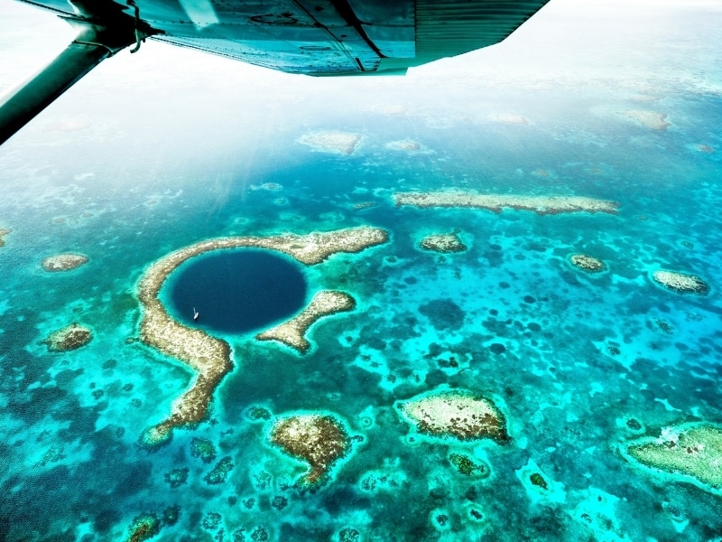 Aerial panoramic view of The Great Blue Hole in Belize's coral reef