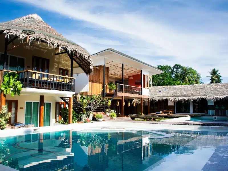Exterior of rooms and swimming pool at a modern homestay in Thailand