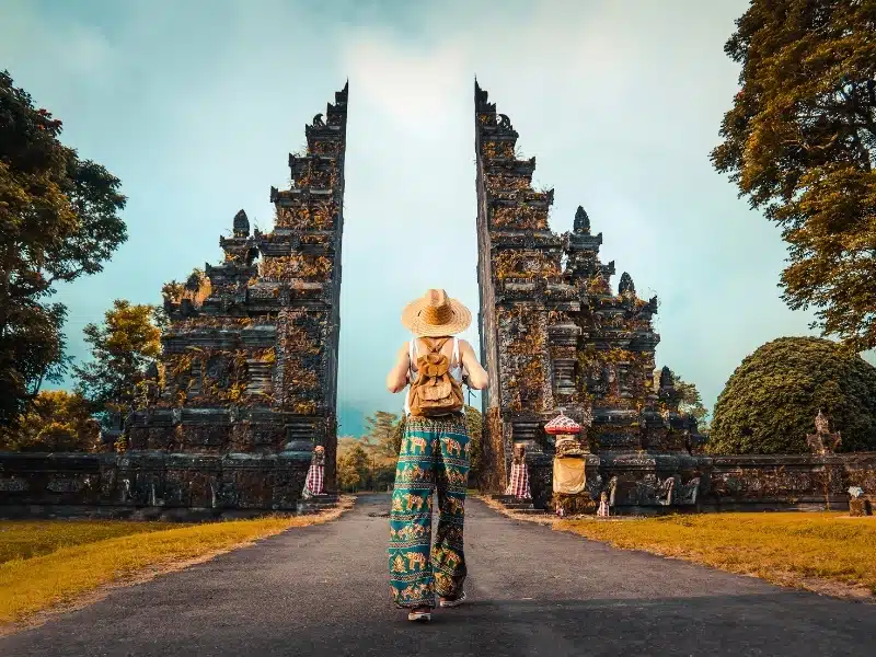 Woman with backpack exploring Bali, Indonesia. 