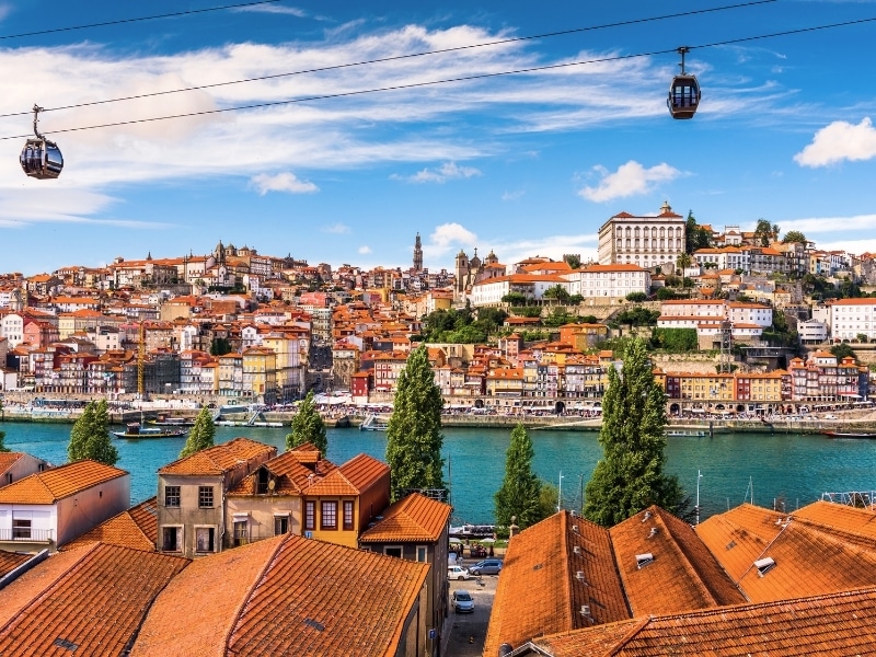 Porto, Portugal old town on the  seen over the roofs of the port wine lodges on the Vila Nova de Gaia side of the Douro River