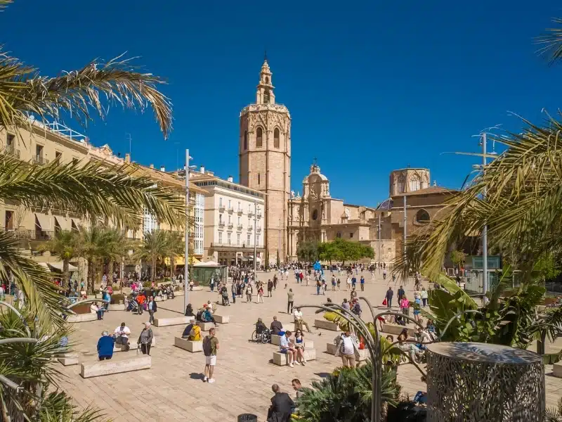 Placa de la Reina square in central part of Valencia city, Spain. Beautiful Queen's Square with Cathedral and other historic buildings.