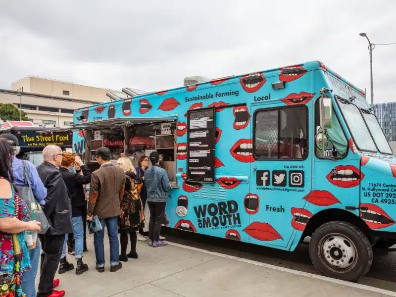 Street food truck and people waiting in the city center of LA