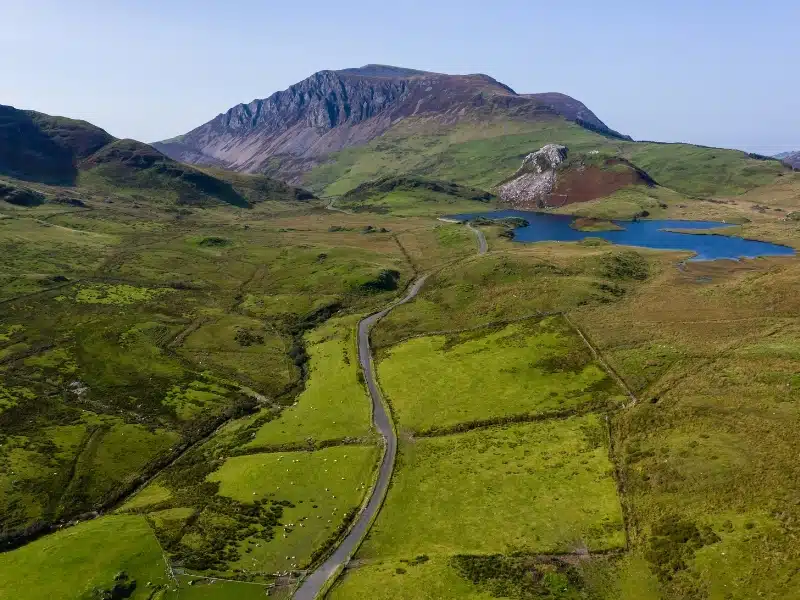 Aerial view of a winding road through beautiful mountainous scenery (Rhyd Ddu, Snowdonia, Wales)