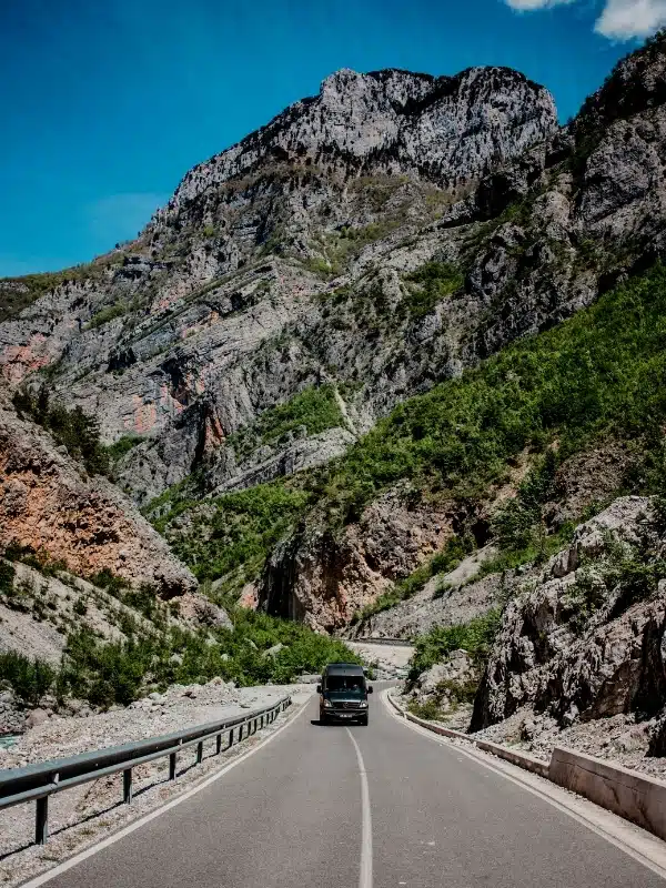 Bridge over the river in Berat, Albania with the old town in the background.