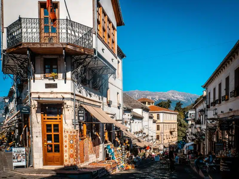 Traditional Albanian buildings on hilly cobblestone streets