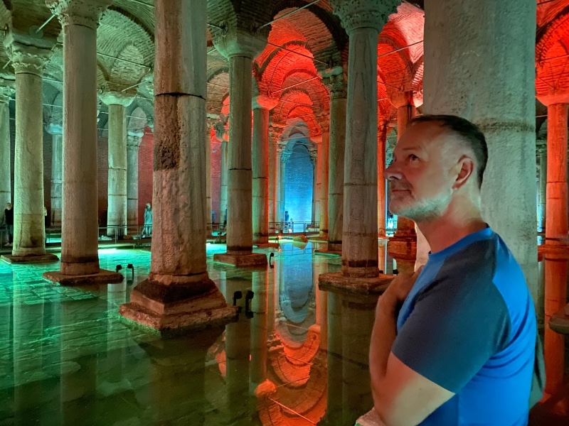 Man in a historic underground cistern with many columns