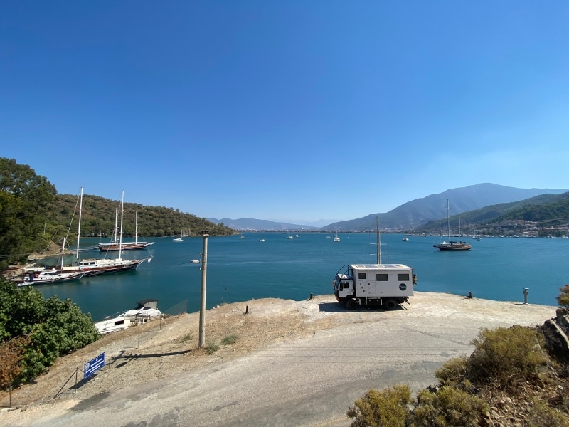 Motorhome parked by a deep blue sea on the Turksih coast