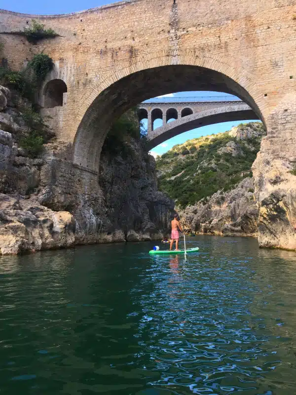 kayaking under the ancient Devil's Bridge from the Herault Gorge