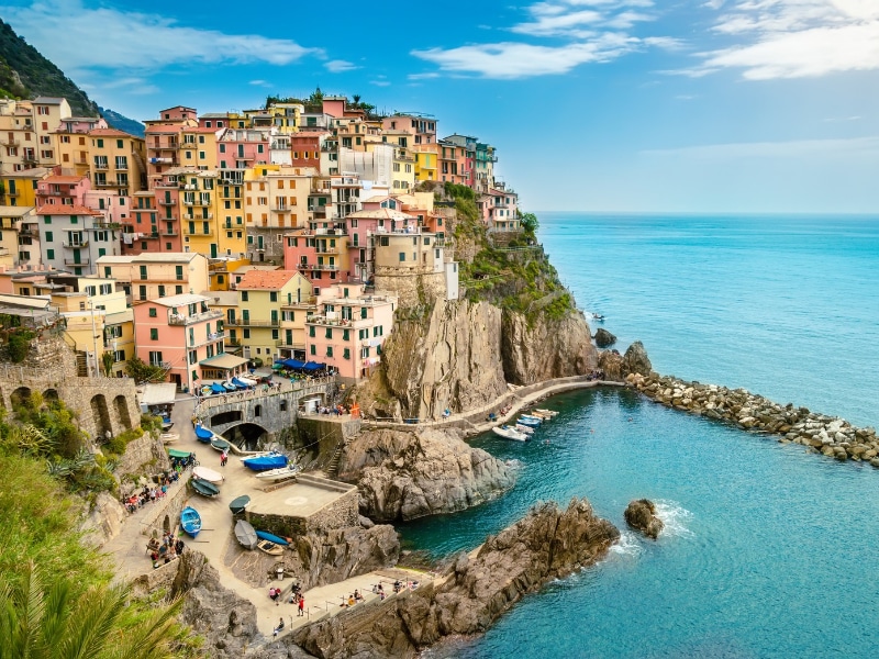 Manarola, Cinque Terre a romantic small village with colorful buildings on cliff overlooking sea.
