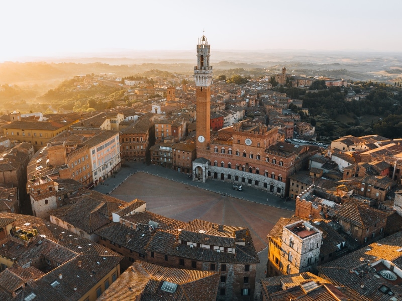 Top aerial view of Piazza del Campo and Siena historic center, Tuscany, Italy