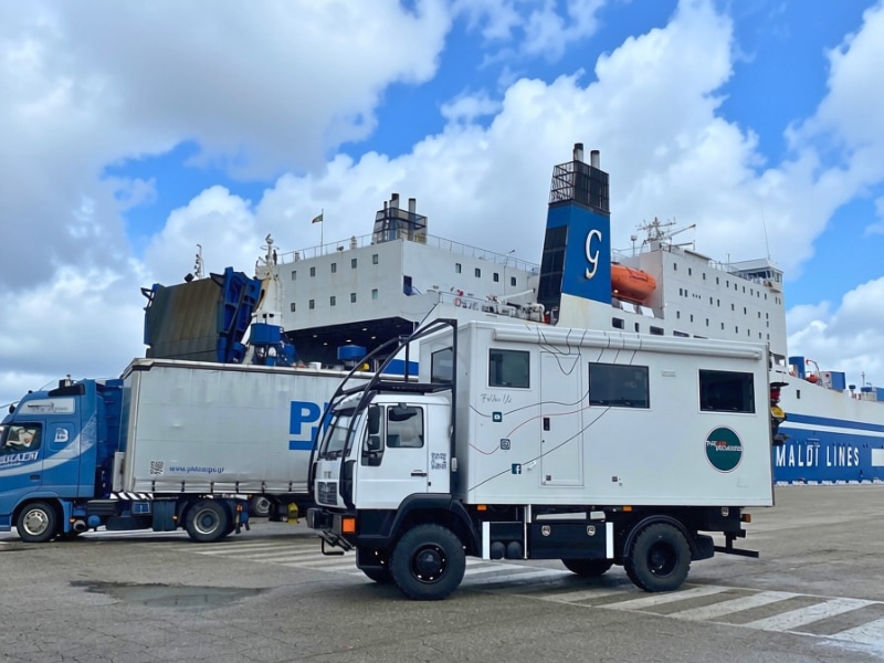 trucks waiting to board a ferry in Italy